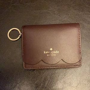 Kate Spade key chain card holder wallet is used but in very good condition.